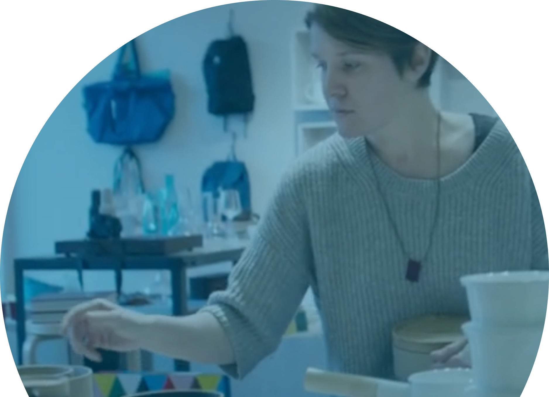 a white woman with short hair in an artist studio
