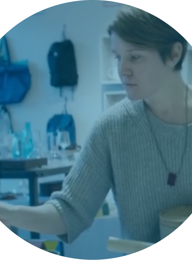 a white woman with short hair in an artist studio