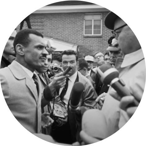 black and white photograph of members of the media interviewing civil rights leaders