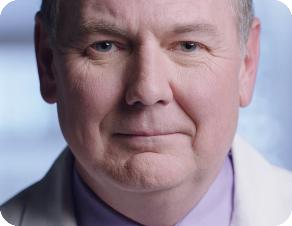 a middle aged white man wearing a lab coat