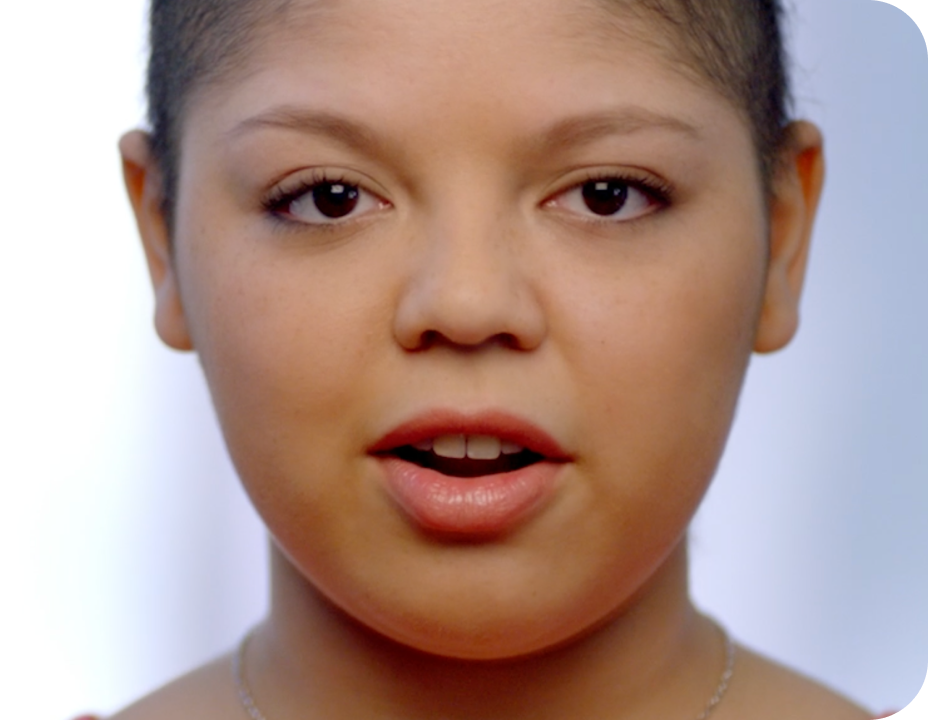 a young woman with short hair speaking