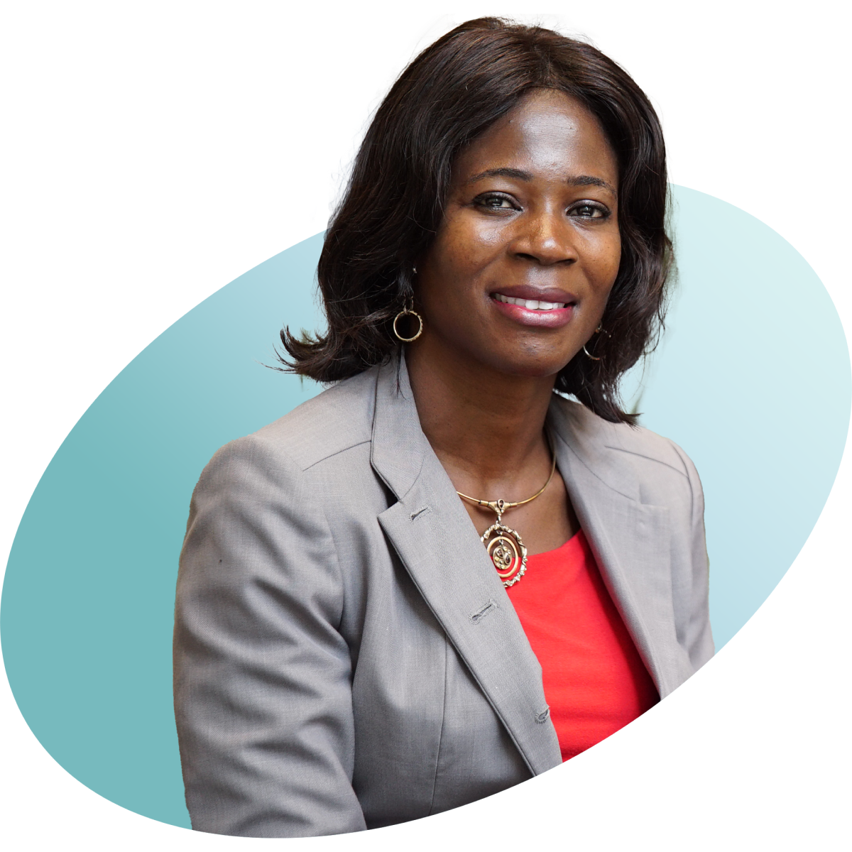 photo of a black businesswoman wearing an orange top and grey jacket